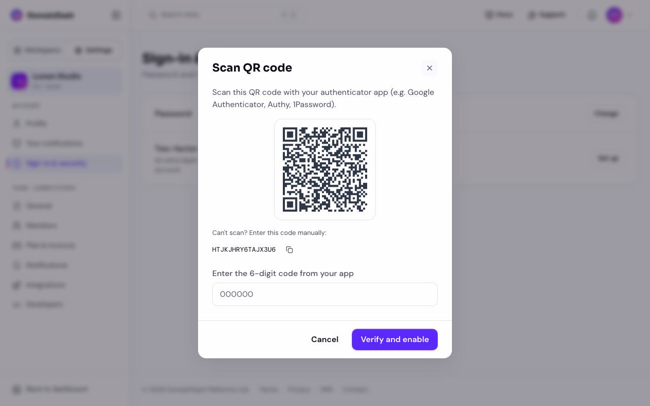 The two-factor authentication setup modal showing a QR code to scan, a manual setup key beneath it, and a field to enter the 6-digit verification code